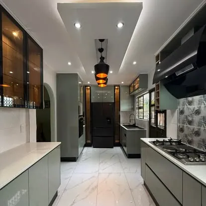 Dark kitchen with glass cabinets
