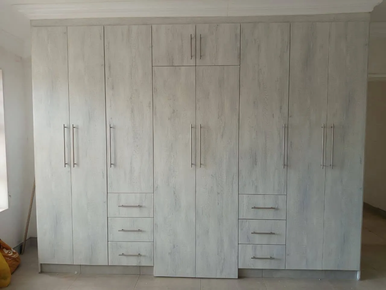 Whitewash built-in wardrobe wall
